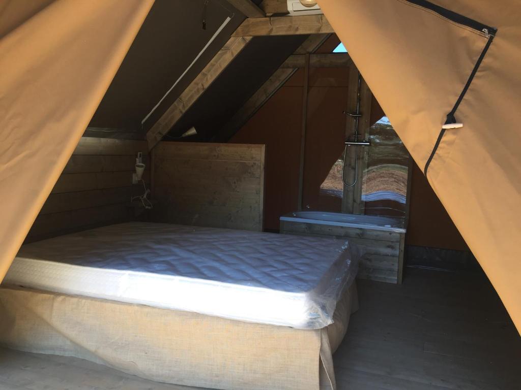 Cama o camas de una habitación en agricampeggio GLAMPING MARCONI