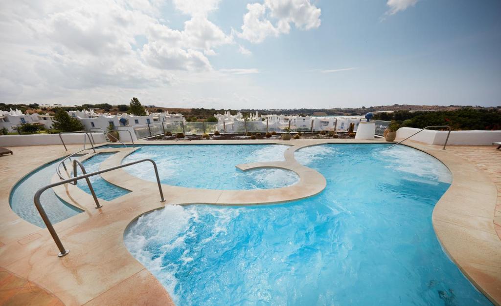 a large swimming pool on top of a building at VOI Marsa Siclà Essentia in Sampieri