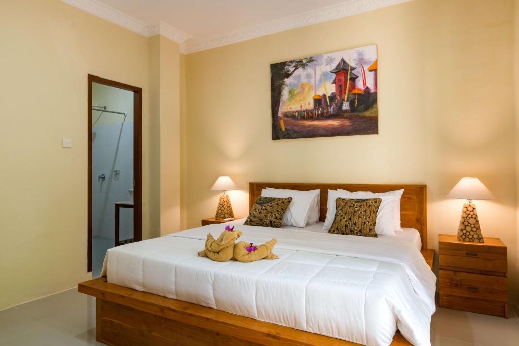 Postel nebo postele na pokoji v ubytování Alam Pangkung Ubud