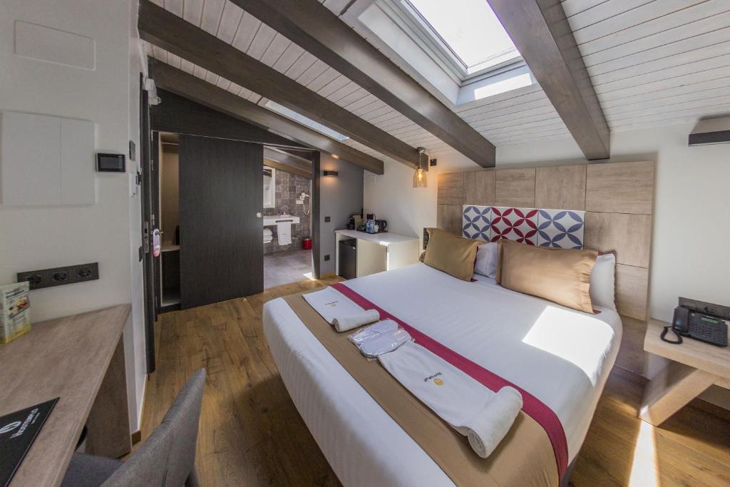 Llit o llits en una habitació de Boutique Hostemplo Sagrada Familia
