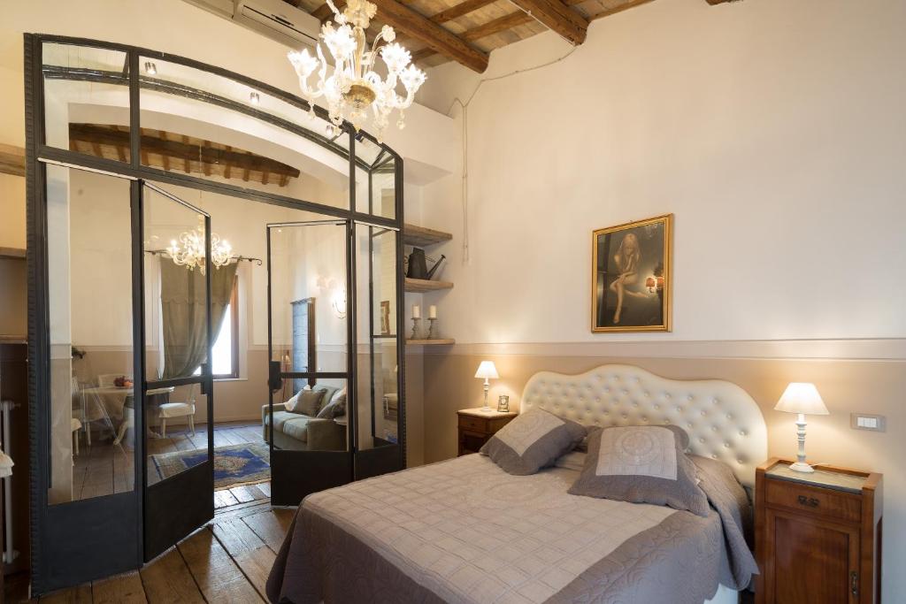 Giường trong phòng chung tại Caterina Residenza