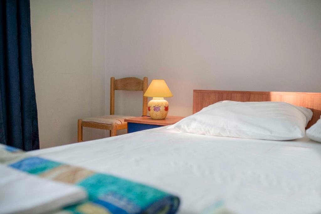 Postel nebo postele na pokoji v ubytování Guesthouse Šime