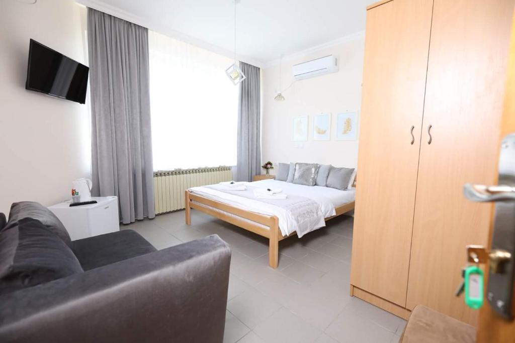 Postel nebo postele na pokoji v ubytování Vila LOLA