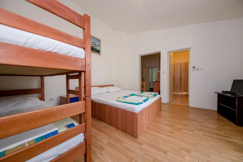 Postel nebo postele na pokoji v ubytování Guesthouse Šime