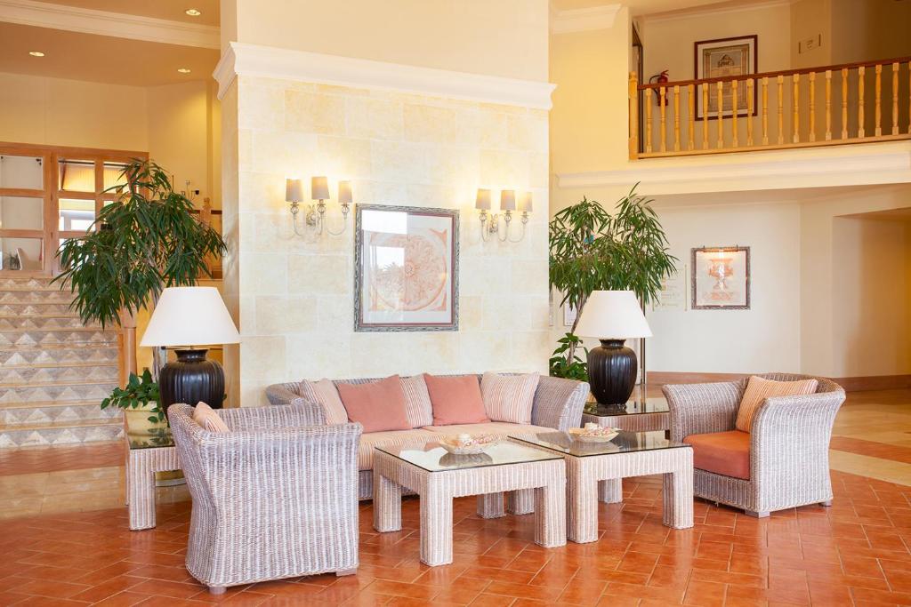 A seating area at Grupotel Macarella Suites & Spa