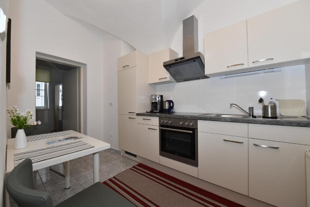 Kuchyň nebo kuchyňský kout v ubytování Apartments Alter Platz