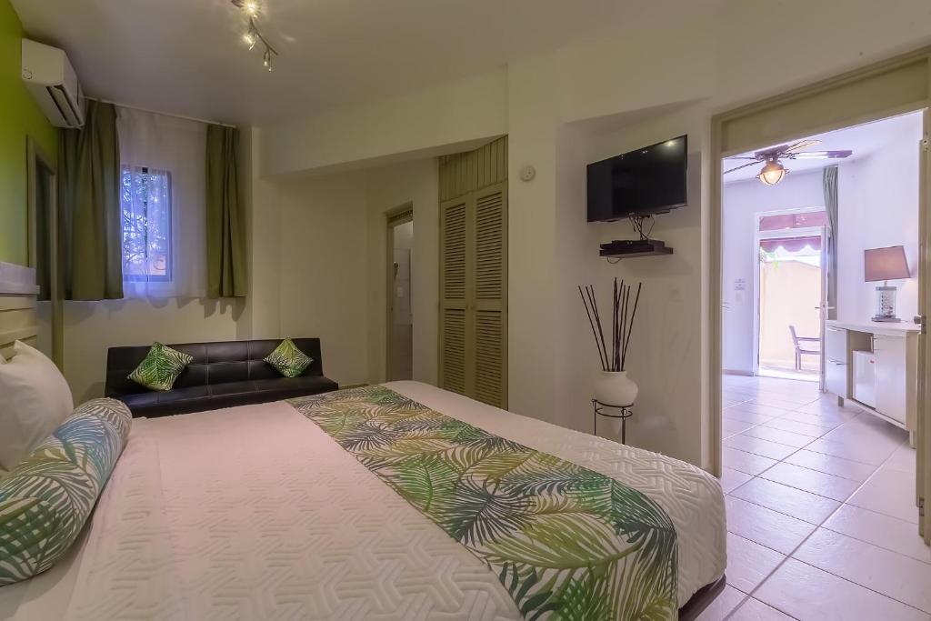 Postel nebo postele na pokoji v ubytování Hotel Villa Taina