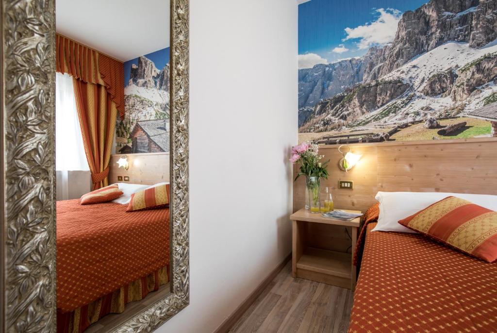 Postel nebo postele na pokoji v ubytování Hotel Touring