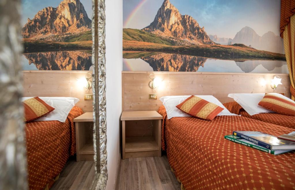 Postel nebo postele na pokoji v ubytování Hotel Touring