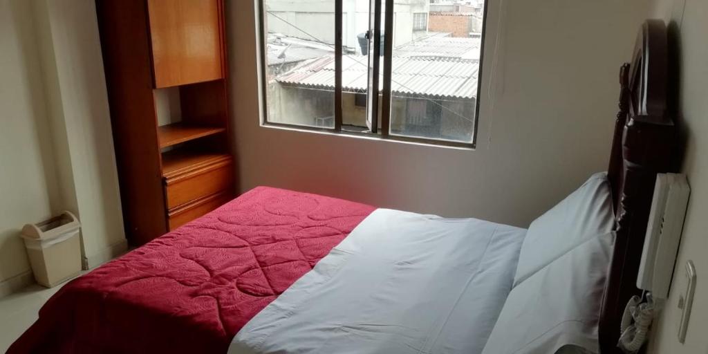 Postel nebo postele na pokoji v ubytování Hostal Fontanar Prado