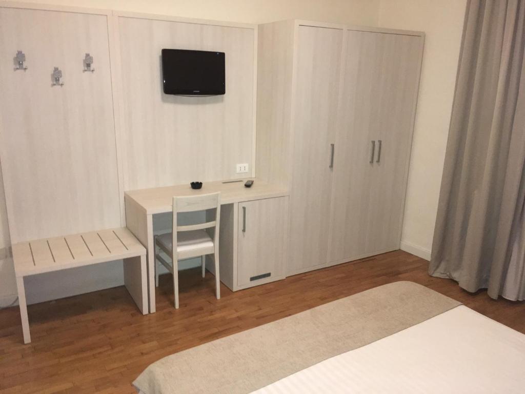 Postel nebo postele na pokoji v ubytování Hotel La Pace