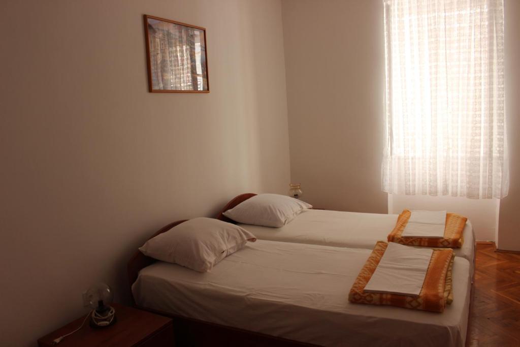 Posteľ alebo postele v izbe v ubytovaní Dudić apartmani