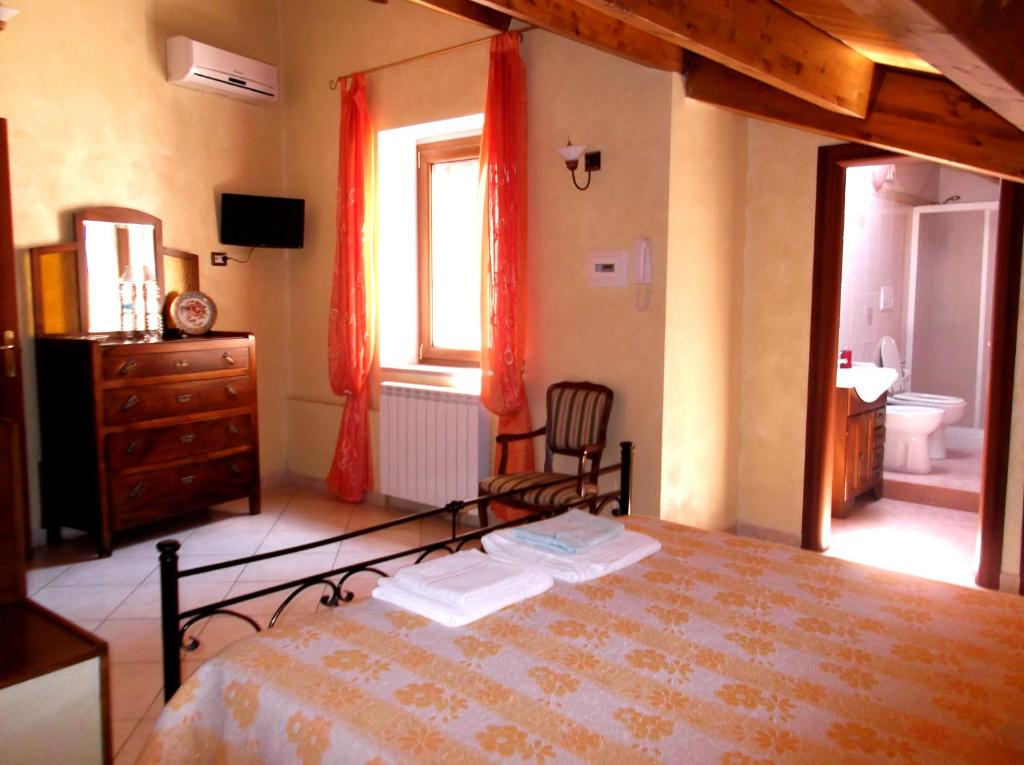 Postel nebo postele na pokoji v ubytování Dolcedorme Bed And Breakfast