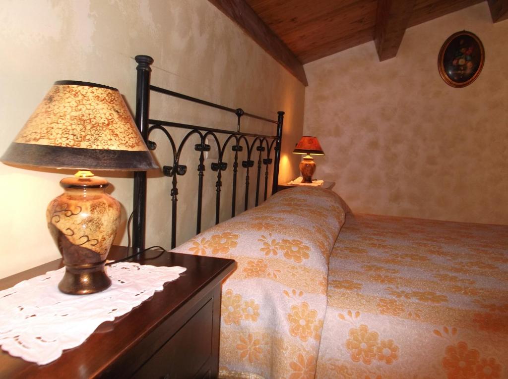 Postel nebo postele na pokoji v ubytování Dolcedorme Bed And Breakfast