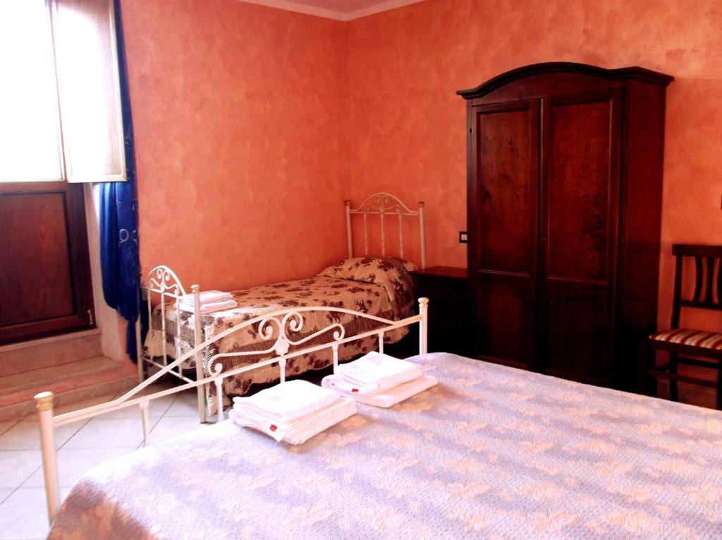 Postel nebo postele na pokoji v ubytování Dolcedorme Bed And Breakfast