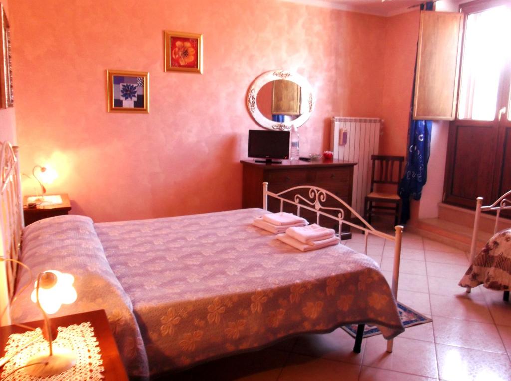 Postel nebo postele na pokoji v ubytování Dolcedorme Bed And Breakfast