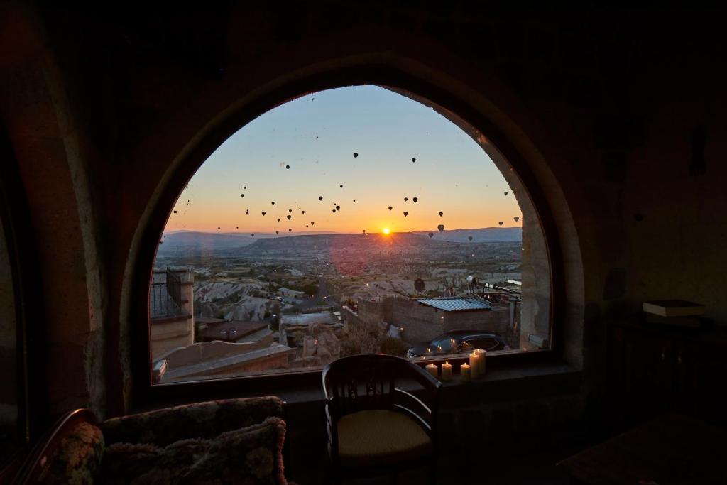 a window in a train looking out at the sunset at Wings Cappadocia in Uchisar