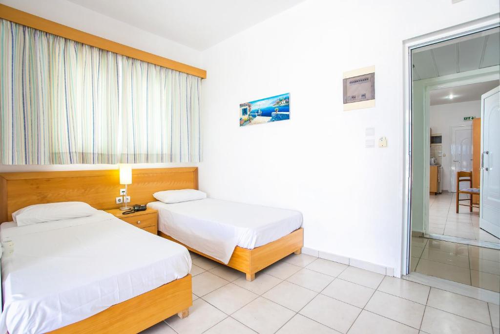 Postel nebo postele na pokoji v ubytování Mon Repos Hotel