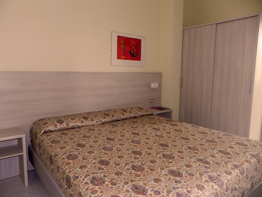 Postel nebo postele na pokoji v ubytování Albergo Sant'Anna