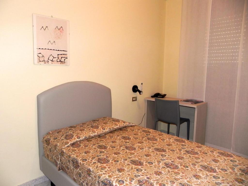 Postel nebo postele na pokoji v ubytování Albergo Sant'Anna