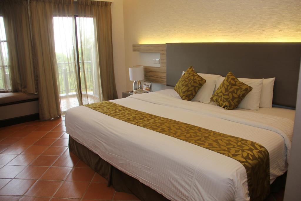 Letto o letti in una camera di Thistle Port Dickson Resort