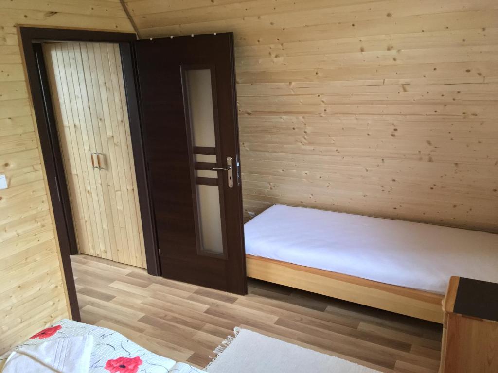 Postel nebo postele na pokoji v ubytování Cottage Family