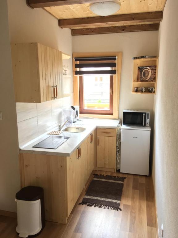 Kuchyň nebo kuchyňský kout v ubytování Cottage Family