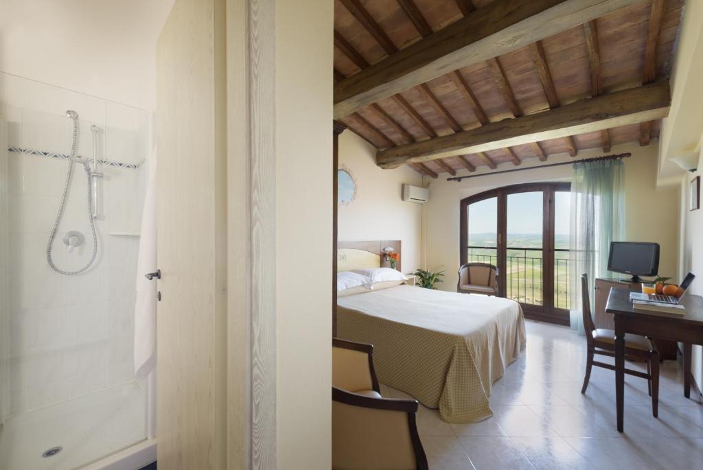 Postel nebo postele na pokoji v ubytování Hotel Dei Capitani