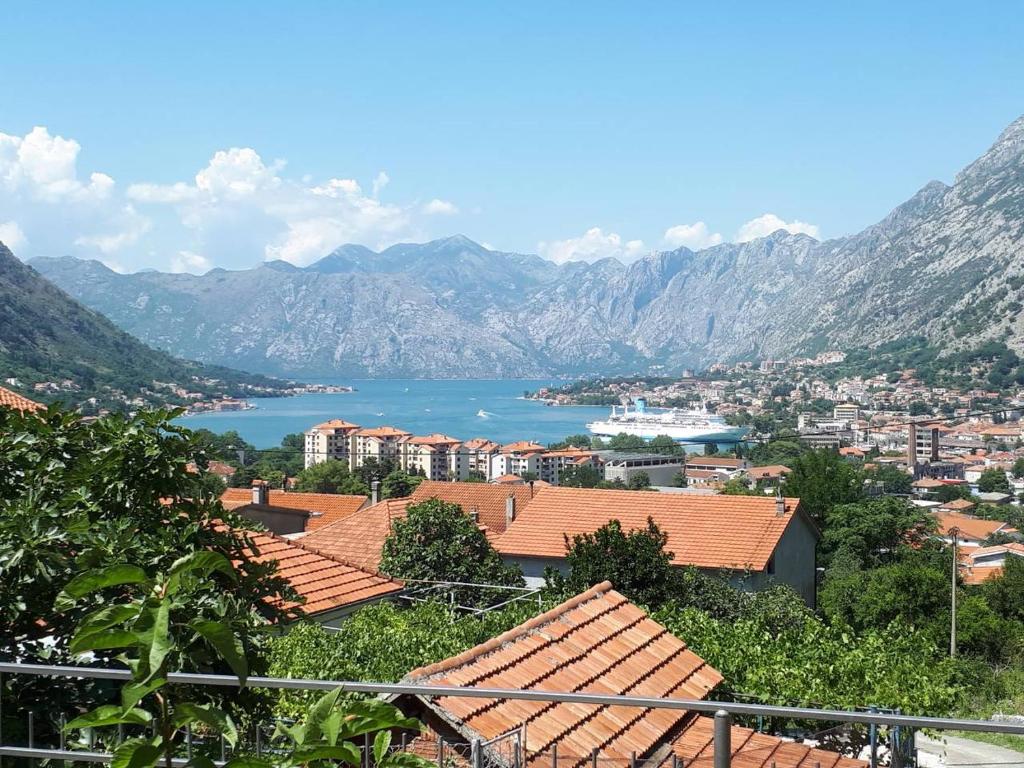 a view of a town with mountains and a lake at Apartment Marta in Kotor