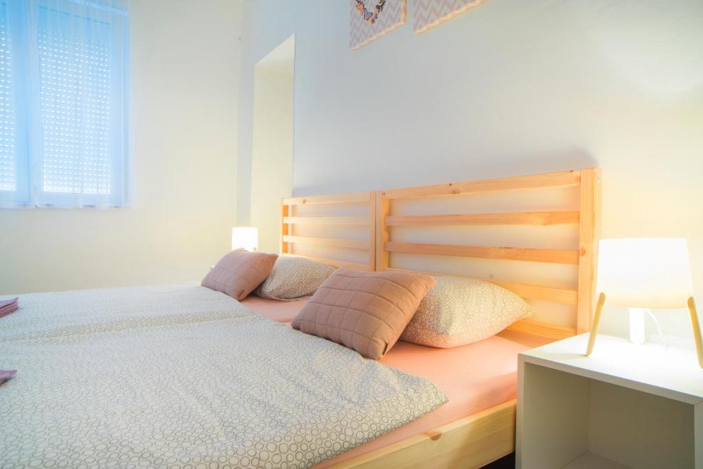 Postel nebo postele na pokoji v ubytování Apartman Višnja