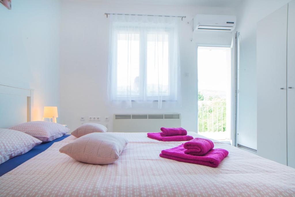 Postel nebo postele na pokoji v ubytování Apartman Višnja