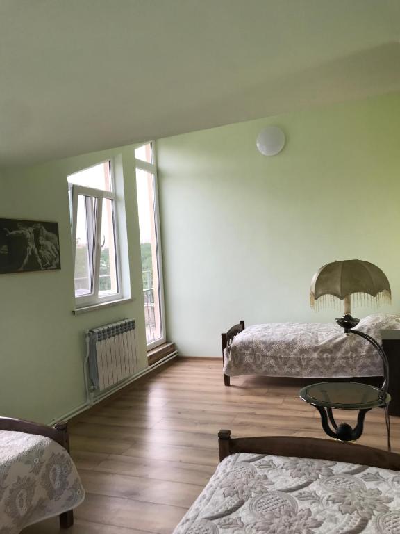 Postel nebo postele na pokoji v ubytování COMMUNE hotel