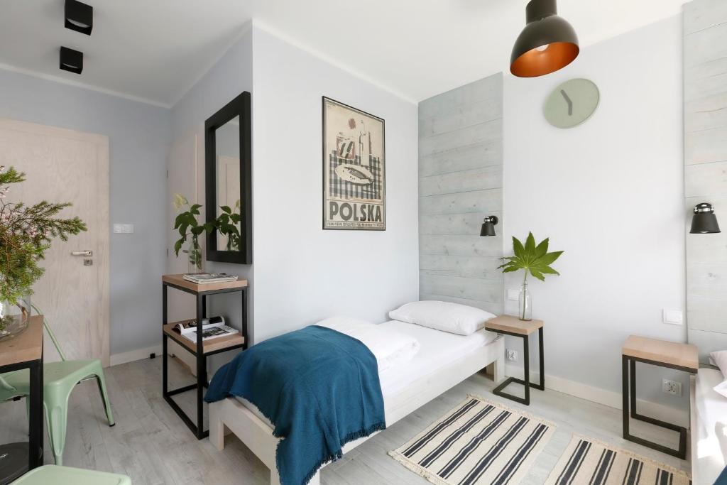 Postel nebo postele na pokoji v ubytování Pokoje i Apartamenty Poddąbie 2