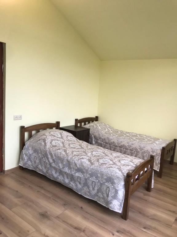 Postel nebo postele na pokoji v ubytování COMMUNE hotel