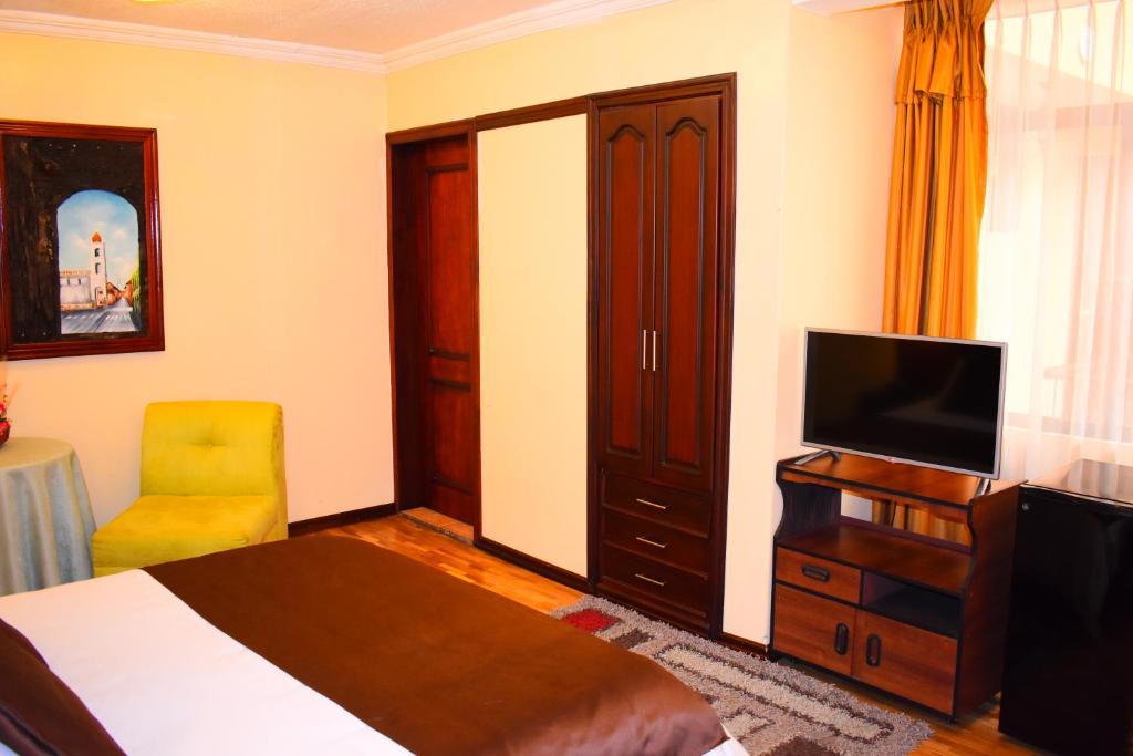 TV a/nebo společenská místnost v ubytování Endamo Hotel