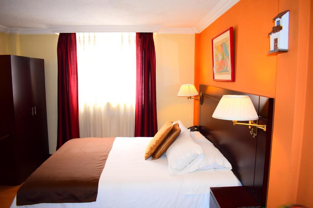 Postel nebo postele na pokoji v ubytování Endamo Hotel