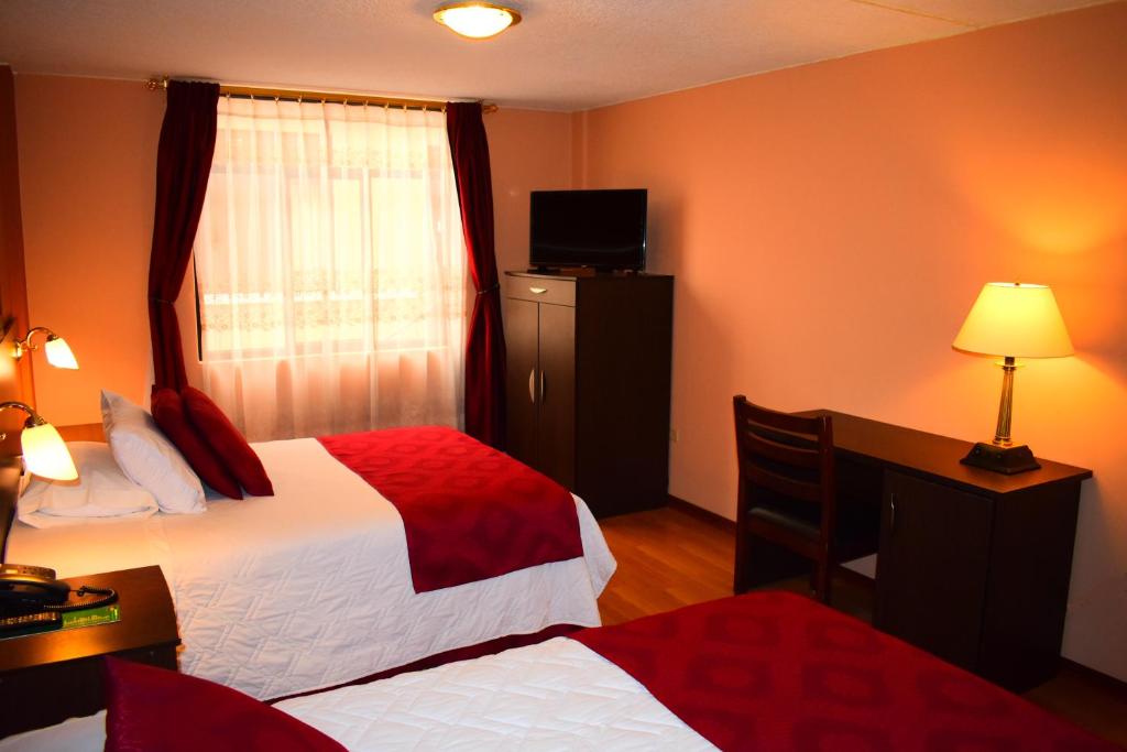 Postel nebo postele na pokoji v ubytování Endamo Hotel