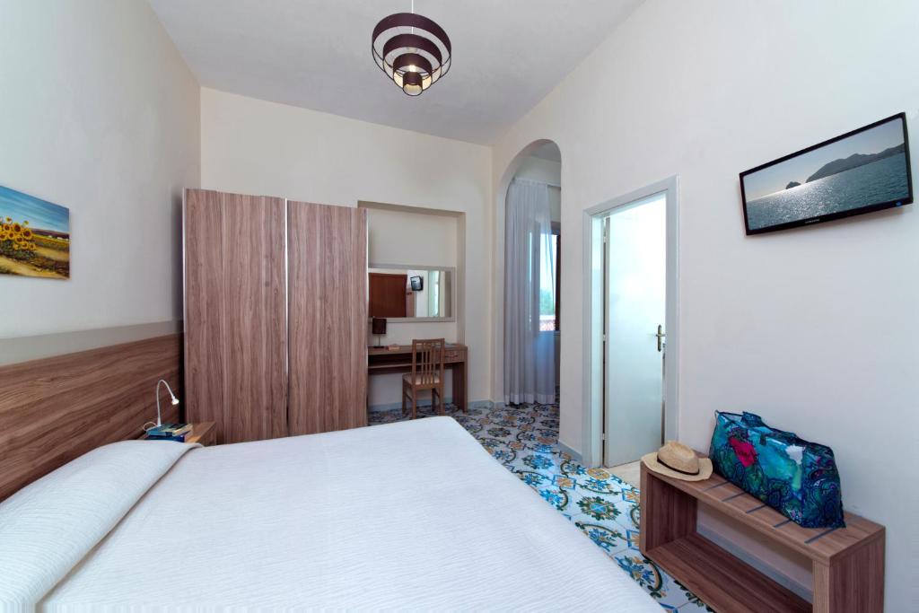 Postel nebo postele na pokoji v ubytování Hotel Casa Di Meglio