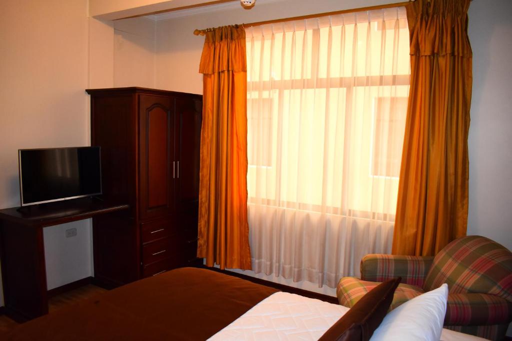 Postel nebo postele na pokoji v ubytování Endamo Hotel