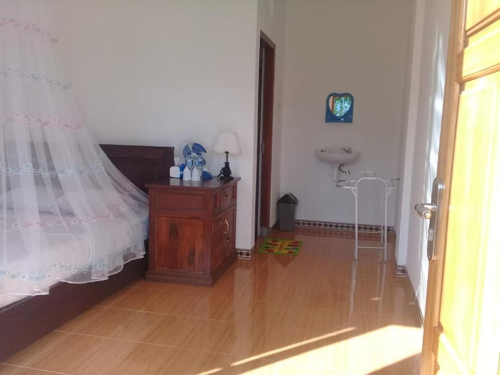 TV a/nebo společenská místnost v ubytování Aris Homestay and Warung Made