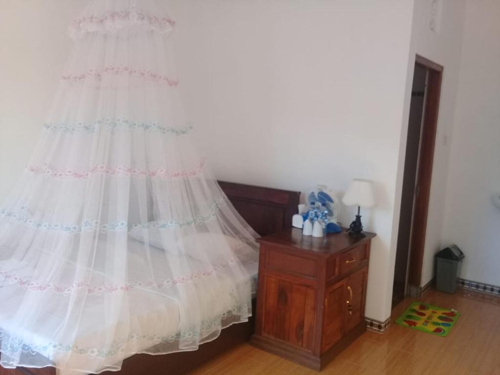 Postel nebo postele na pokoji v ubytování Aris Homestay and Warung Made