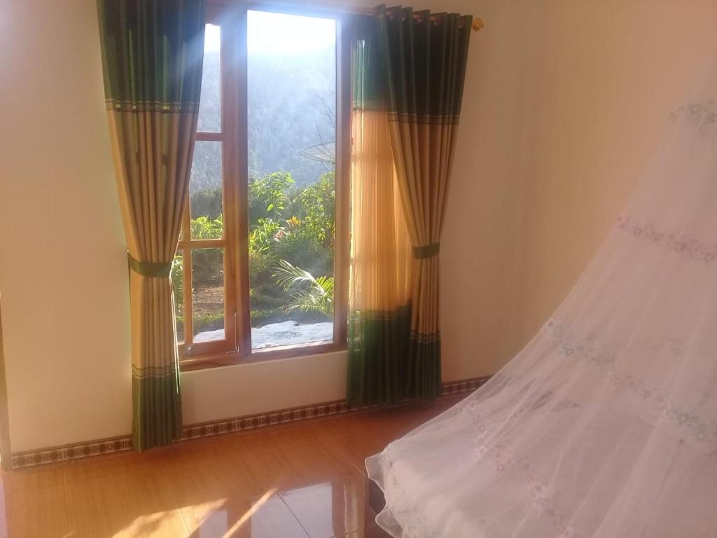 Postel nebo postele na pokoji v ubytování Aris Homestay and Warung Made