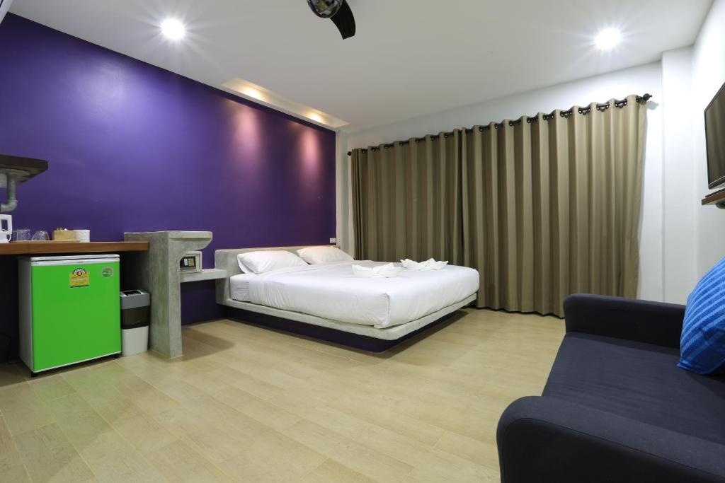 Postel nebo postele na pokoji v ubytování Good Dream Hotel (Khun Ying House)