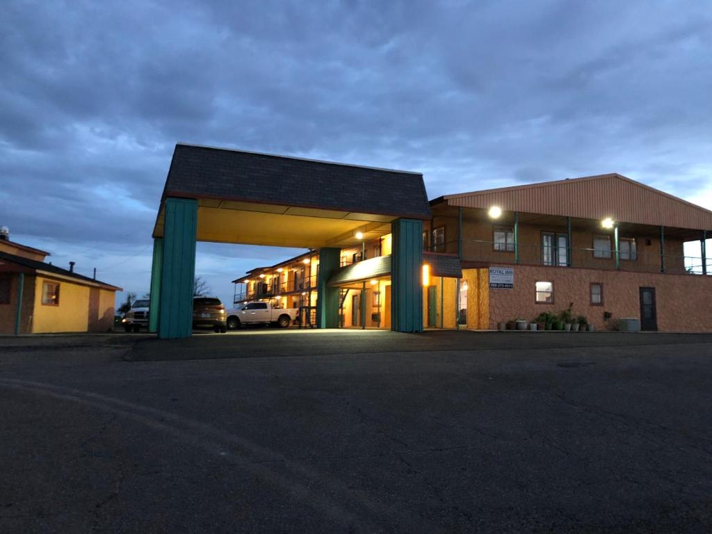 a building with a parking lot in front of it at Royal Inn Borger in Borger