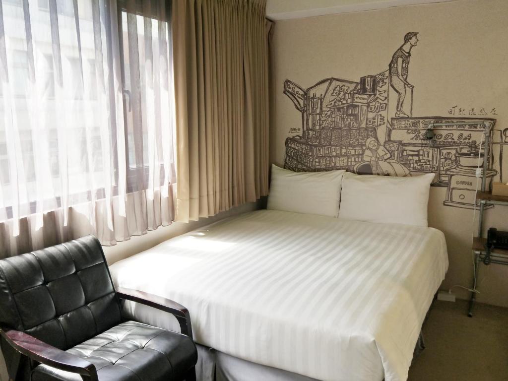 Postel nebo postele na pokoji v ubytování Cho Hotel