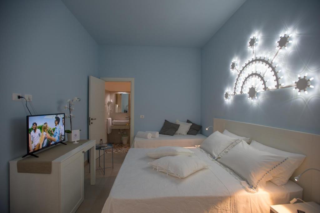 Posteľ alebo postele v izbe v ubytovaní Luci del Salento Guest House