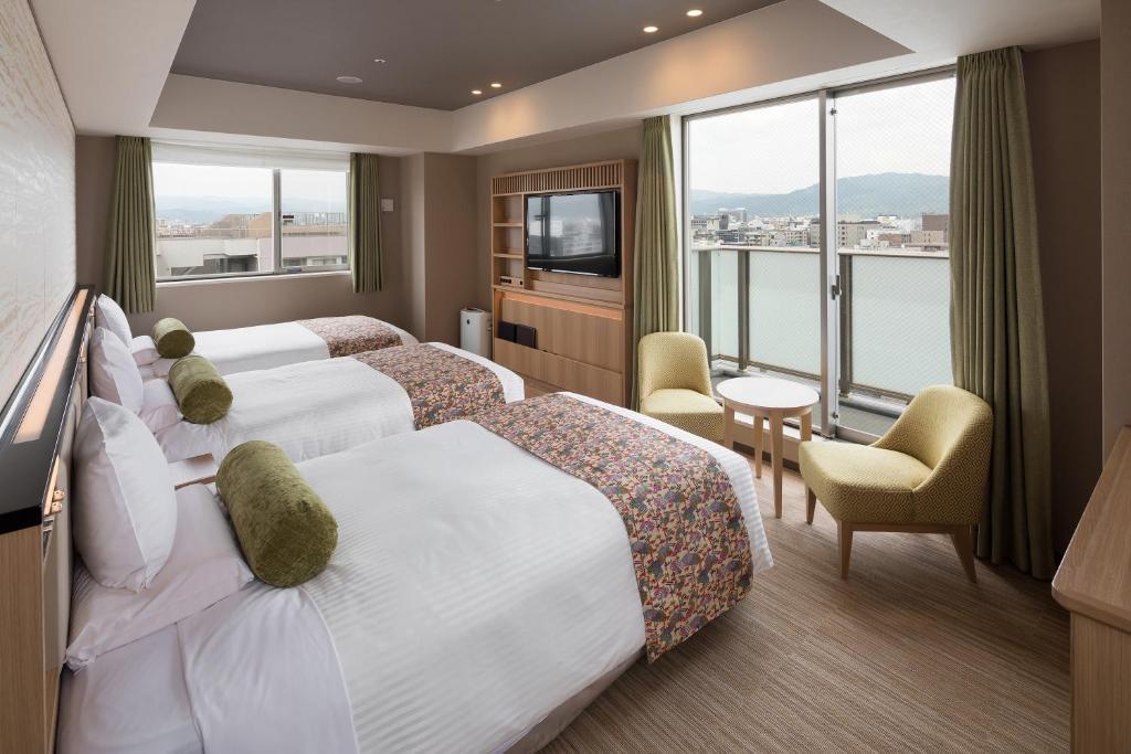 Postel nebo postele na pokoji v ubytování HOTEL MYSTAYS Kyoto Shijo