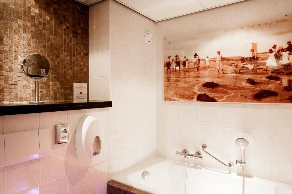 Koupelna v ubytování Hotel Greenside Texel