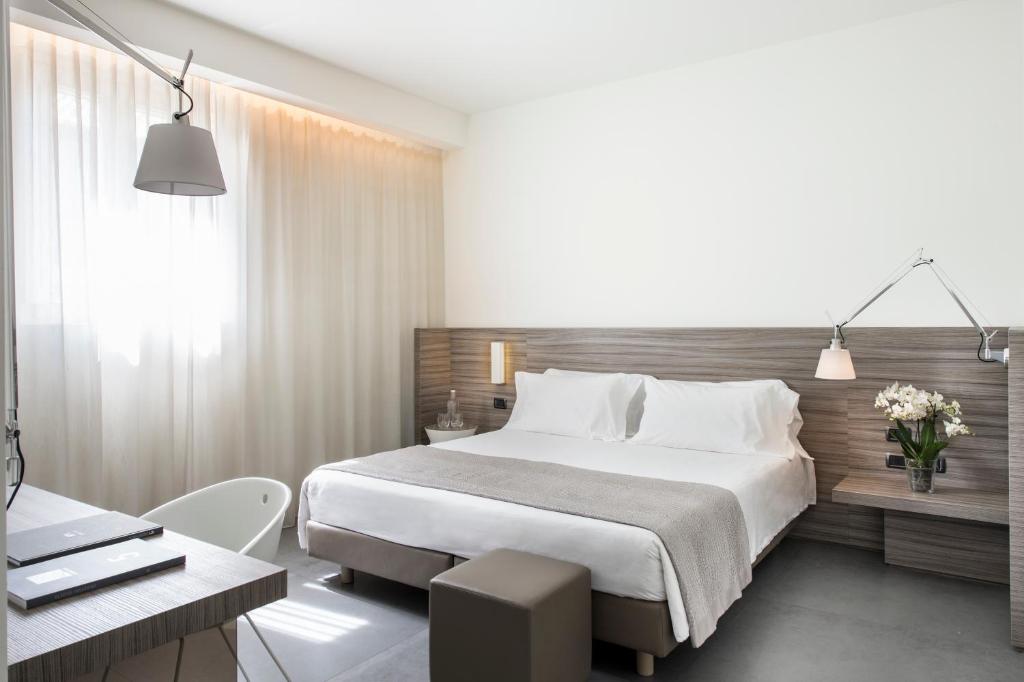 Postel nebo postele na pokoji v ubytování Hotel & Resort Le Colombare