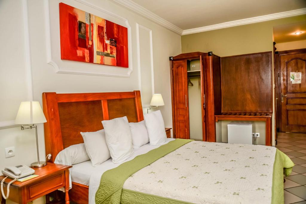 Postel nebo postele na pokoji v ubytování Tchero Hotel
